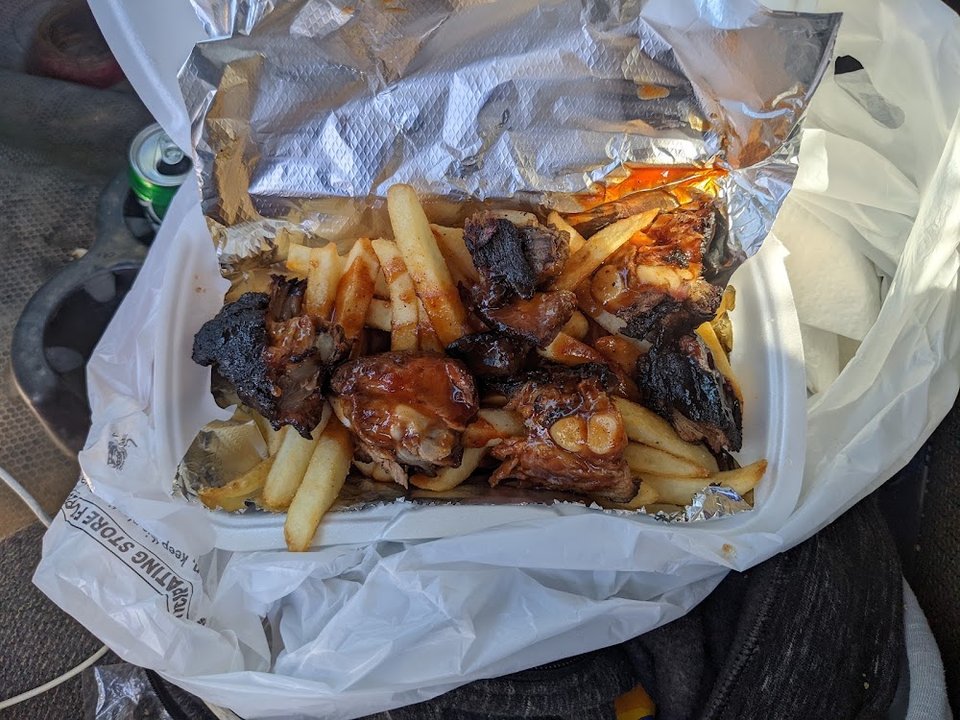 Takeout menu with ribs, sandwiches, and sides.