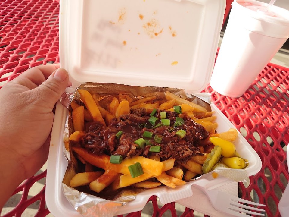 Takeout menu with ribs, sandwiches, and sides.